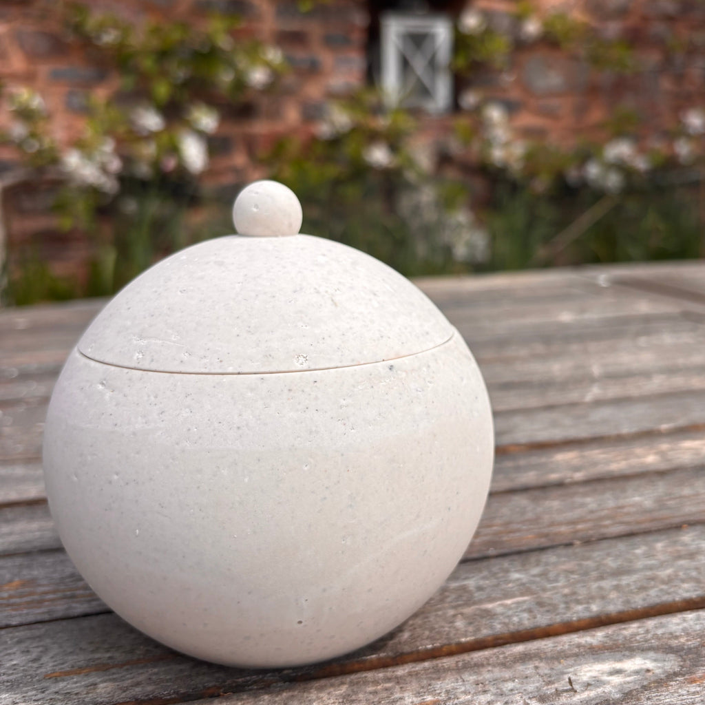 Afterstone ash into stone spherical pot with lid