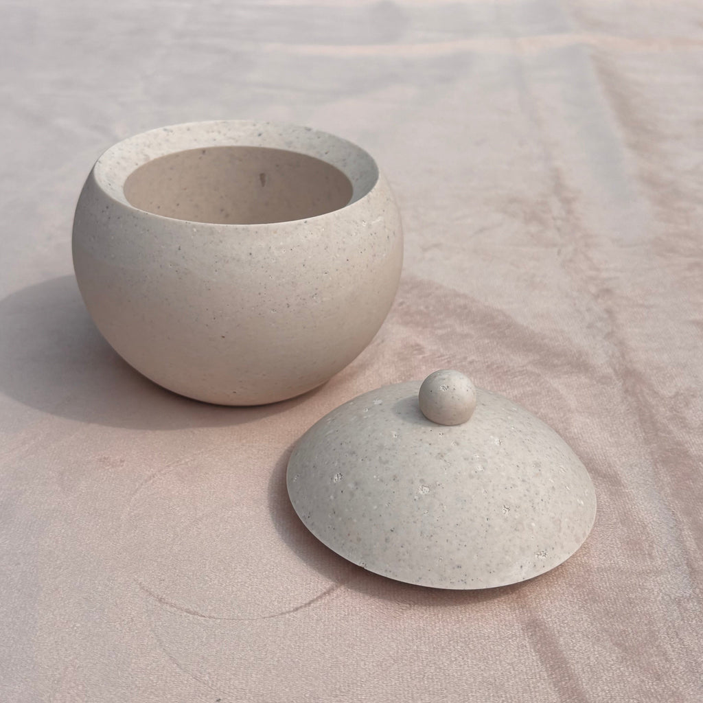 Afterstone ash into stone spherical pot with lid