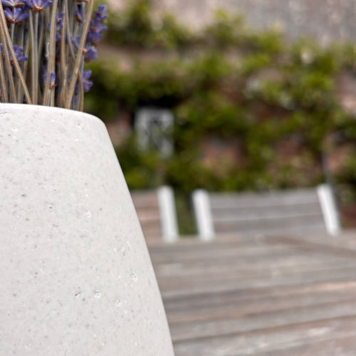 Vases made from human or pet ashes with lavender in natural light